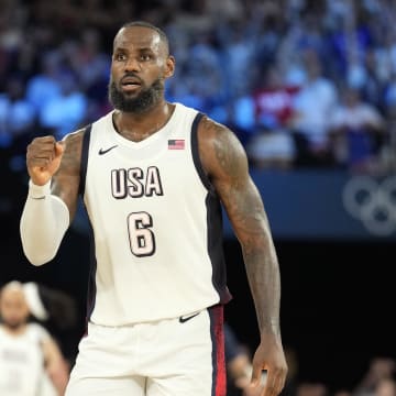 Aug 8, 2024; Paris, France; United States guard LeBron James (6) celebrates during the second half against Serbia in a men's basketball semifinal game during the Paris 2024 Olympic Summer Games at Accor Arena. Mandatory Credit: Kyle Terada-USA TODAY Sports