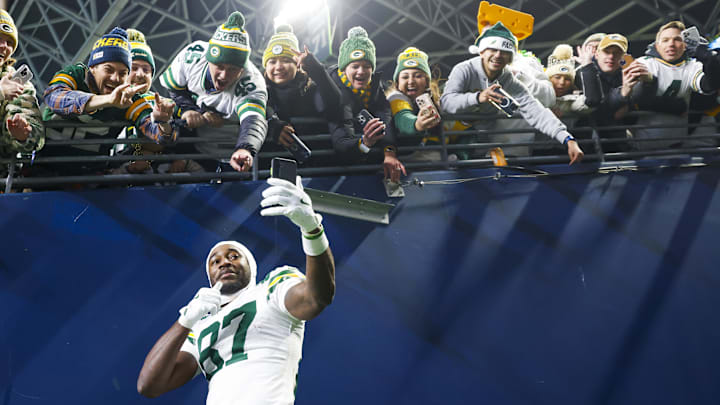 Green Bay Packers wide receiver Romeo Doubs (87) takes a selfie with fans following a victory against the Seattle Seahawks. Green Bay Packers wide receiver Romeo Doubs (87) takes a selfie with fans following a victory against the Seattle Seahawks.