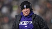 Northwestern Wildcats head coach Pat Fitzgerald walks the sidelines