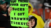 Dec 29, 2024; Cleveland, Ohio, USA; A Cleveland Browns fan holds a sign during the second half against the Miami Dolphins at Huntington Bank Field. Mandatory Credit: Ken Blaze-Imagn Images