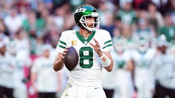 Nov 10, 2024; Glendale, Arizona, USA; New York Jets quarterback Aaron Rodgers (8) passes against the Arizona Cardinals during the second half at State Farm Stadium.