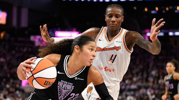 A photo of Veronica Burton driving past Natasha Mack