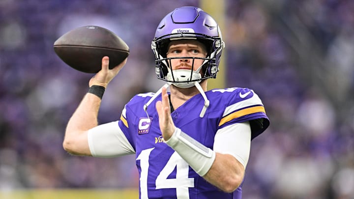 Dec 29, 2024; Minneapolis, Minnesota, USA; Minnesota Vikings quarterback Sam Darnold (14) warms up before the game against the Green Bay Packers at U.S. Bank Stadium. Mandatory Credit: Jeffrey Becker-Imagn Images