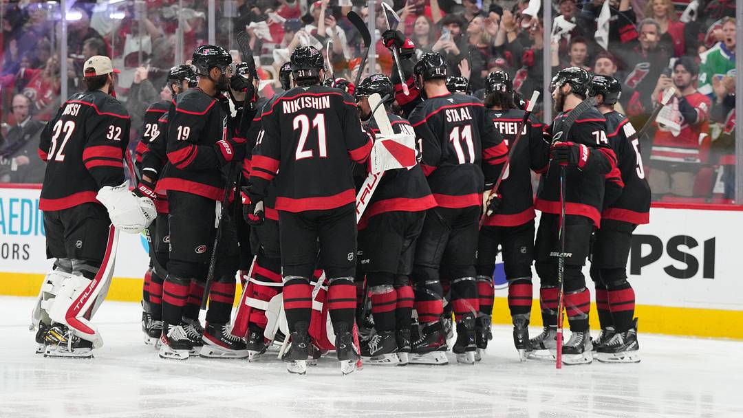 May 23, 2026; Raleigh, North Carolina, USA; The Carolina Hurricanes celebrate after scoring an overtime goal against the Montréal Canadiens in game two of the Eastern Conferene Final of the 2026 Stanley Cup Playoffs at Lenovo Center. Mandatory Credit: James Guillory-Imagn Images