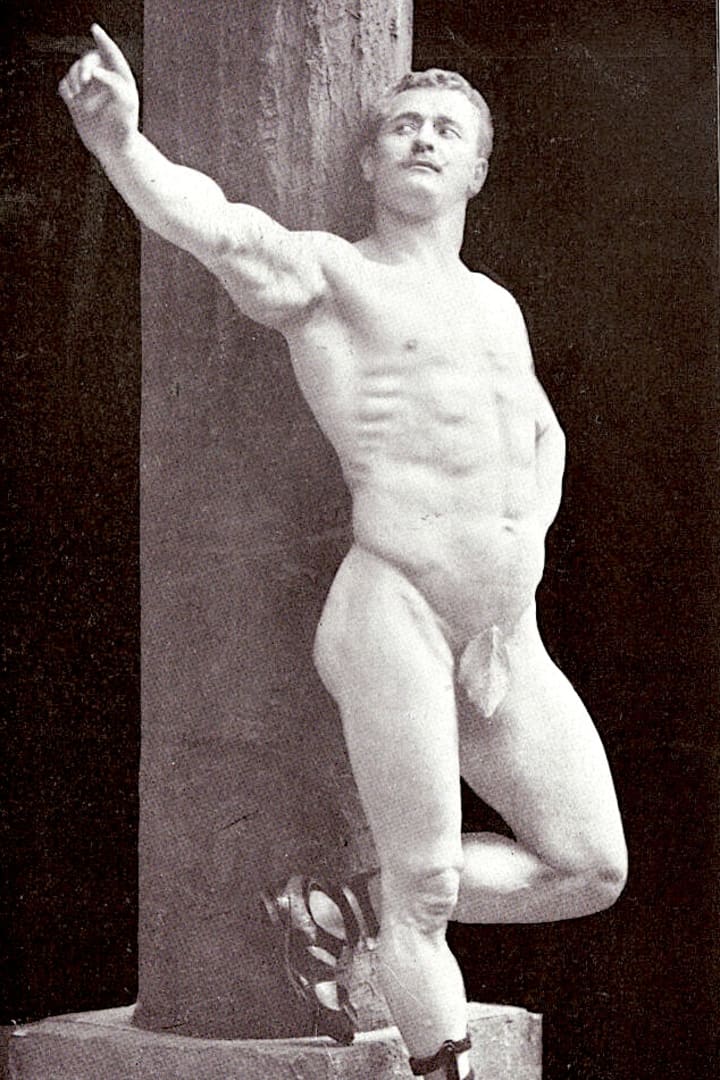 Eugen Sandow in a statuesque bodybuilding pose against a marble column