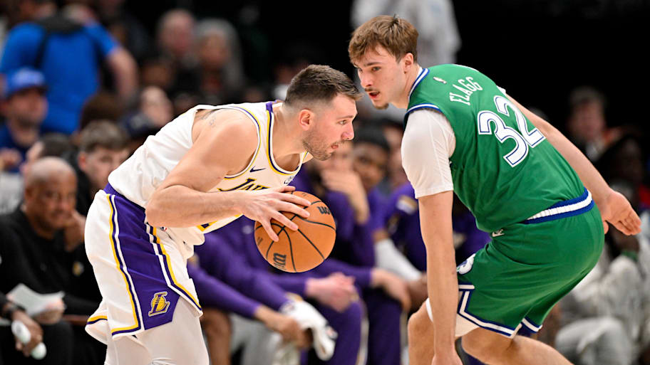Los Angeles Lakers guard Luka Doncic moves the ball to the basket past Dallas Mavericks forward Cooper Flagg.