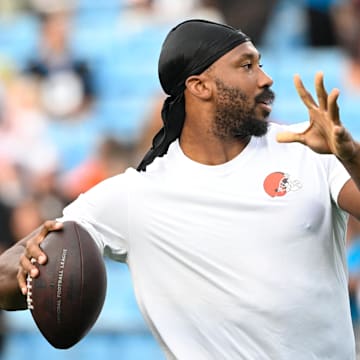 Aug 8, 2025; Charlotte, North Carolina, USA; Cleveland Browns defensive end Myles Garrett (95) passes the ball before the game at Bank of America Stadium. Mandatory Credit: Bob Donnan-Imagn Images