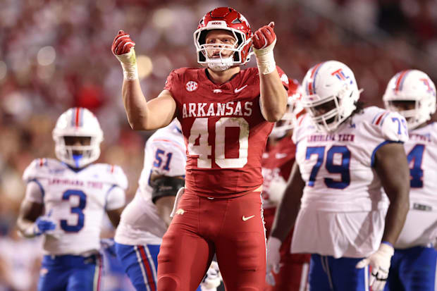 Arkansas Razorbacks DE Landon Jackson celebrates after sacking Louisiana Tech Bulldogs quarterback Evan Bullock