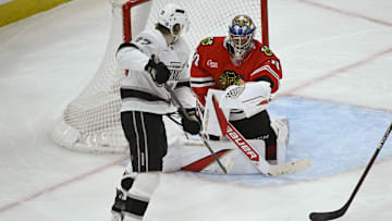 Mar 3, 2025; Chicago, Illinois, USA;  Chicago Blackhawks goaltender Spencer Knight defends against Los Angeles Kings left wing Warren Foegele (37) during the second period at the United Center. Mandatory Credit: Matt Marton-Imagn Images