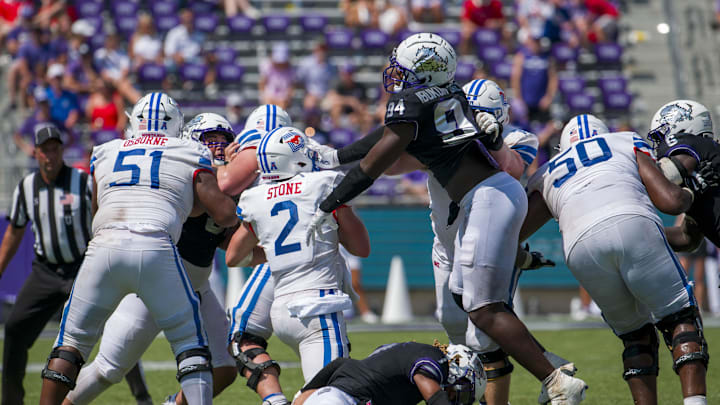 SMU Mustangs quarterback  is sacked by the TCU Horned Frogs defense  Mandatory Credit: Jerome Miron-Imagn Images