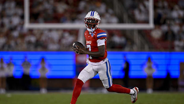 SMU quarterback Kevin Jennings (7) runs with the ball during the game between the SMU Mustangs and the East Texas A&M Lions
