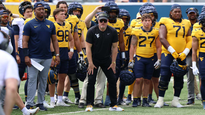 Former West Virginia University specialist and honorary coach Pat McAfee watches a 1v1 drill during the 2024 Gold-Blue Spring Game