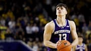 Jan 19, 2025; Ann Arbor, Michigan, USA;  Northwestern Wildcats guard Brooks Barnhizer (13) takes a free throw in overtime against the Michigan Wolverines at Crisler Center. Mandatory Credit: Rick Osentoski-Imagn Images