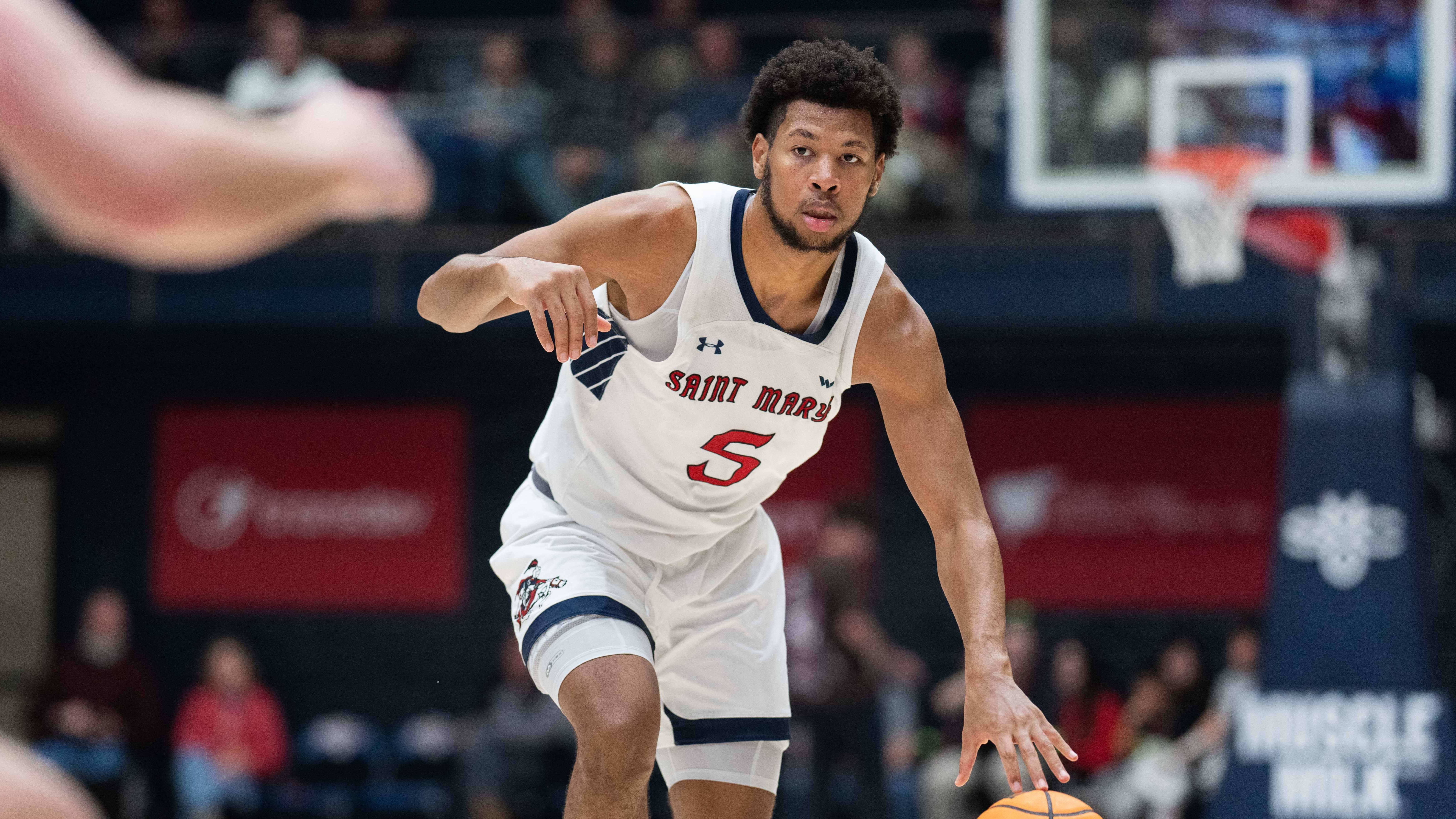 Joshua Jefferson handles the ball during the Saint Mary's men's basketball game against Utah.