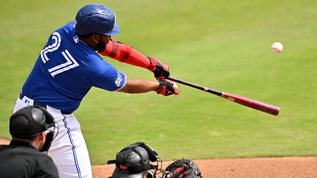 Feb 26, 2026; Dunedin, Florida, USA; Toronto Blue Jays first baseman Vladimir Guerrero Jr. (27) hits a RBI double in the second inning against the Florida Marlins during spring training at TD Ballpark. Mandatory Credit: Jonathan Dyer-Imagn Images