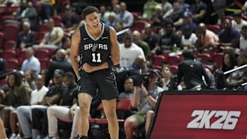 Jul 10, 2025; Las Vegas, NV, USA; San Antonio Spurs forward Carter Bryant (11) reacts to a play against the Philadelphia 76ers in the first quarter of their game at Thomas & Mack Center. Mandatory Credit: Candice Ward-Imagn Images