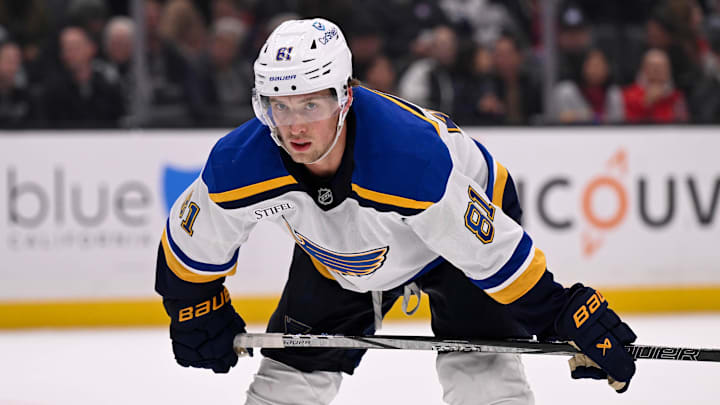 Mar 5, 2025; Los Angeles, California, USA;  St. Louis Blues center Dylan Holloway (81) prepares for a face-off against the Los Angeles Kings during the third period at Crypto.com Arena. Mandatory Credit: Alex Gallardo-Imagn Images