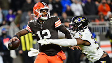 Nov 16, 2025; Cleveland, Ohio, USA; Cleveland Browns quarterback Shedeur Sanders (12) is sacked by Baltimore Ravens linebacker Trenton Simpson (32) during the fourth quarter at Huntington Bank Field. Mandatory Credit: Ken Blaze-Imagn Images