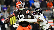 Nov 16, 2025; Cleveland, Ohio, USA; Cleveland Browns quarterback Shedeur Sanders (12) is sacked by Baltimore Ravens linebacker Trenton Simpson (32) during the fourth quarter at Huntington Bank Field. Mandatory Credit: Ken Blaze-Imagn Images
