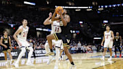 Mar 21, 2025; Cleveland, OH, USA; Vanderbilt Commodores forward Devin McGlockton (99) shoots the ball defended by St. Mary's Gaels center Mitchell Saxen (11) in the second half at Rocket Arena. Mandatory Credit: Rick Osentoski-Imagn Images