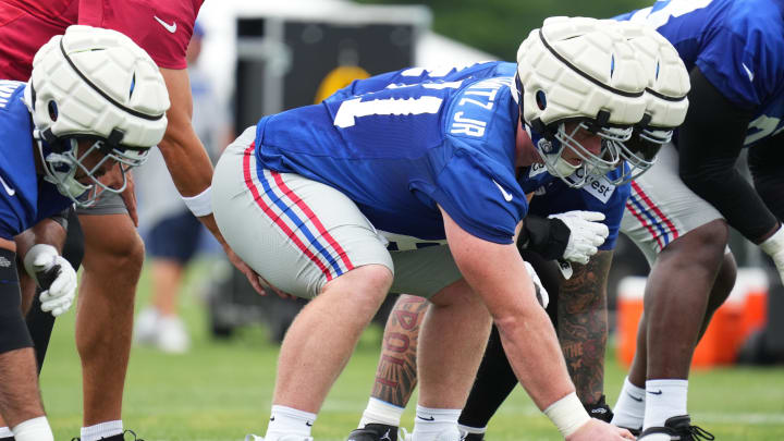 Jul 25, 2024; East Rutherford, NY, USA; New York Giants center John Michael Schmitz Jr. (61) waits to snap the ball during training camp at Quest Diagnostics Training Center. Mandatory Credit: Lucas Boland-USA TODAY Sports