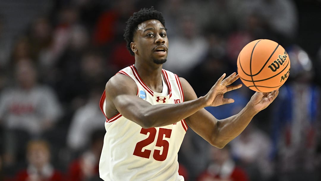 Mar 19, 2026; Portland, OR, USA; Wisconsin Badgers guard John Blackwell (25) passes against the High Point Panthers during the first half of a first round game of the men's 2026 NCAA Tournament at Moda Center. Mandatory Credit: Craig Strobeck-Imagn Images