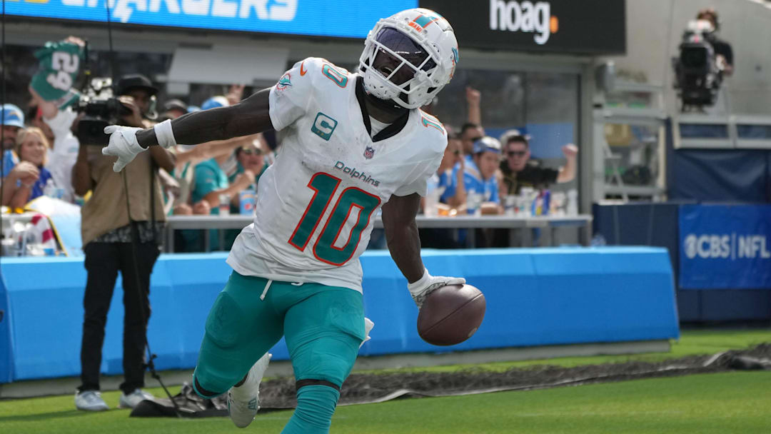 Sep 10, 2023; Inglewood, California, USA; Miami Dolphins wide receiver Tyreek Hill (10) celebrates after catching a 35-yard touchdown pass in the third quarter against the Miami Dolphins at SoFi Stadium. Mandatory Credit: Kirby Lee-Imagn Images