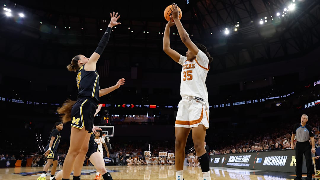 Mar 30, 2026; Fort Worth, TX, USA;  Texas Longhorns forward Madison Booker (35) scores a basket against Michigan Wolverines forward Ashley Sofilkanich (15) during the first half at Dickies Arena. Mandatory Credit: Chris Jones-Imagn Images