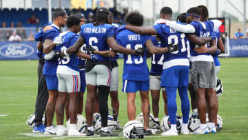 Jul 25, 2024; East Rutherford, NY, USA; New York Giants players gather in a huddle after training camp at Quest Diagnostics Training Center.  