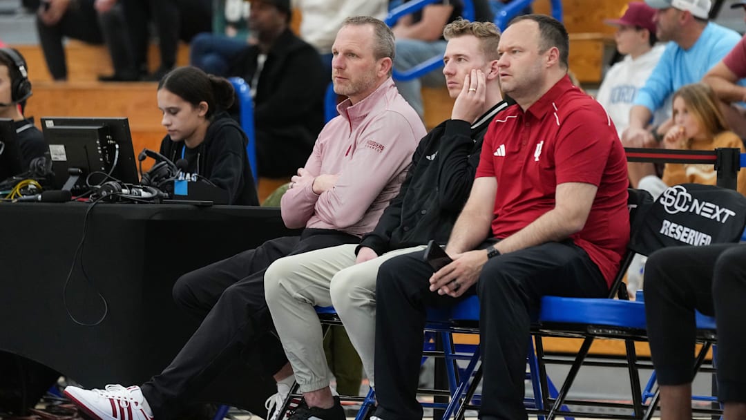Indiana University men's head basketball coach Darian DeVries (left) watches the game Wednesday, April 2, 2025, during the first game of the Chipotle Nationals at Hamilton Southeastern High School in Fishers.