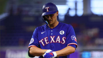 Jun 2, 2024; Miami, Florida, USA; Texas Rangers shortstop Corey Seager (5) looks on from first base after hitting a single against the Miami Marlins during the first inning at loanDepot Park. Mandatory Credit: Sam Navarro-USA TODAY Sports