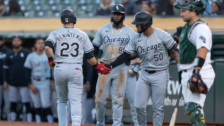 Aug 6, 2024; Oakland, California, USA;  Chicago White Sox outfielder Andrew Benintendi (23) celebrates with designated hitter Lenyn Sosa (50) and outfielder Luis Robert Jr. (88) after hitting a two run home run during the fourth inning against the Oakland Athletics at Oakland-Alameda County Coliseum.