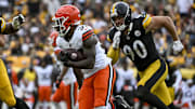 Oct 12, 2025; Pittsburgh, Pennsylvania, USA; Cleveland Browns running back Jerome Ford (34) attempts to run the ball during the second quarter at Acrisure Stadium. Mandatory Credit: Barry Reeger-Imagn Images