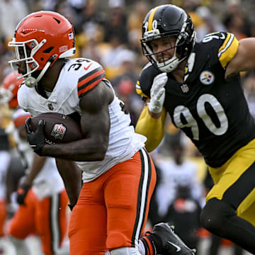 Oct 12, 2025; Pittsburgh, Pennsylvania, USA; Cleveland Browns running back Jerome Ford (34) attempts to run the ball during the second quarter at Acrisure Stadium. Mandatory Credit: Barry Reeger-Imagn Images