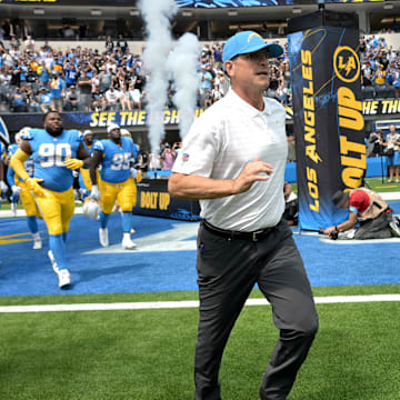 Sep 8, 2024; Inglewood, California, USA; Los Angeles Chargers head coach Jim Harbaugh leads the team on to the field for the game against the Las Vegas Raiders at SoFi Stadium. Mandatory Credit: Jayne Kamin-Oncea-Imagn Images