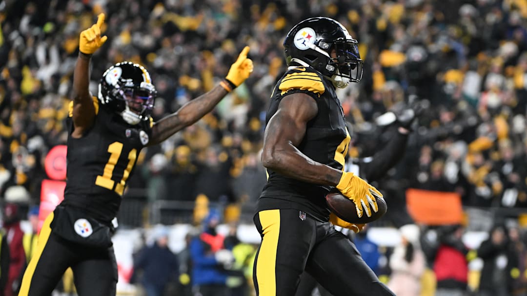 Dec 15, 2025; Pittsburgh, Pennsylvania, USA; Pittsburgh Steelers wide receiver DK Metcalf (4) runs the ball after a catch for a touchdown in the third quarter against the Miami Dolphins at Acrisure Stadium. Mandatory Credit: Barry Reeger-Imagn Images