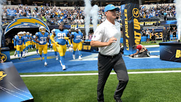 Sep 8, 2024; Inglewood, California, USA; Los Angeles Chargers head coach Jim Harbaugh leads the team on to the field for the game against the Las Vegas Raiders at SoFi Stadium. Mandatory Credit: Jayne Kamin-Oncea-Imagn Images