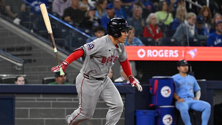 Sep 24, 2025; Toronto, Ontario, CAN;  Boston Red Sox designated hitter Masataka Yoshida (7) loses his bat as he grounds out against the Toronto Blue Jays in the seventh inning at Rogers Centre. Mandatory Credit: Dan Hamilton-Imagn Images