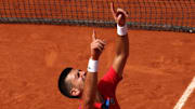 Novak Djokovic emotionally reacts after defeating Carlos Alcaraz to win the gold medal in men's singles on Court Philippe-Chatrier at Roland Garros in the 2024 Paris Olympics on Sunday, August 4. 