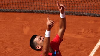 Novak Djokovic emotionally reacts after defeating Carlos Alcaraz to win the gold medal in men's singles on Court Philippe-Chatrier at Roland Garros in the 2024 Paris Olympics on Sunday, August 4. 