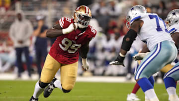Oct 8, 2023; Santa Clara, California, USA; San Francisco 49ers defensive tackle Javon Kinlaw (99) rushes against Dallas Cowboys offensive tackle Tyron Smith (left) during the fourth quarter at Levi's Stadium.