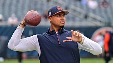 Aug 17, 2024; Chicago, Illinois, USA; Chicago Bears general manager Ryan Poles plays catch on the sideline before the game against the Cincinnati Bengals at Soldier Field. Mandatory Credit: Daniel Bartel-Imagn Images