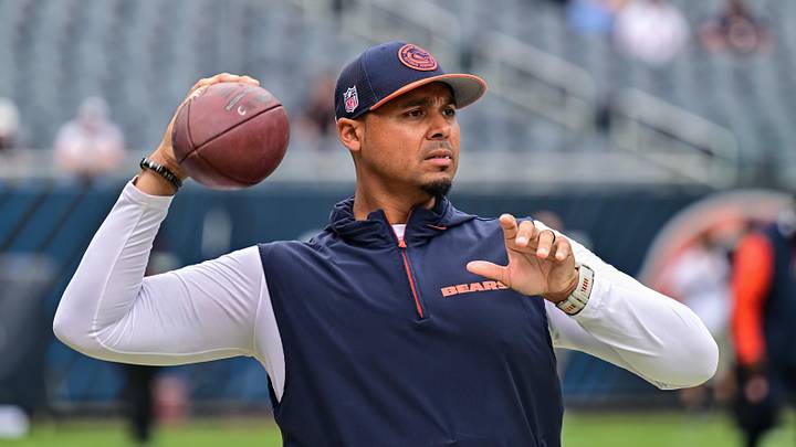 Aug 17, 2024; Chicago, Illinois, USA; Chicago Bears general manager Ryan Poles plays catch on the sideline before the game against the Cincinnati Bengals at Soldier Field. Mandatory Credit: Daniel Bartel-Imagn Images