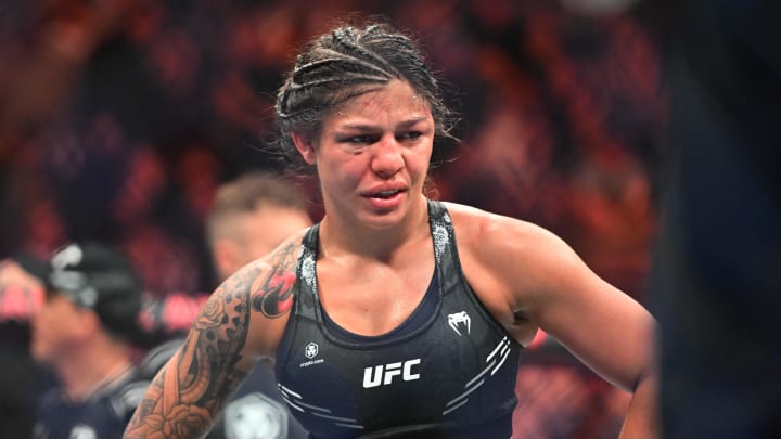 Jan 20, 2024; Toronto, Canada, USA; Mayra Bueno Silva (blue gloves)  reacts after being defeated by Raquel Pennington (red glove) during UFC 297 at ScotiaBank Arena. Mandatory Credit: Dan Hamilton-USA TODAY Sports