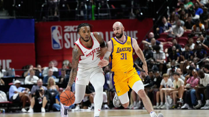 Jul 12, 2024; Las Vegas, NV, USA; Houston Rockets forward Cam Whitmore (7) drives the ball against Los Angeles Lakers guard Tommy Kuhse (31) during the first half at Thomas & Mack Center. Mandatory Credit: Lucas Peltier-USA TODAY Sports