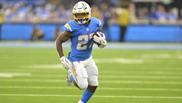 Oct 27, 2024; Inglewood, California, USA;  Los Angeles Chargers running back J.K. Dobbins (27) carries for a first down in the first half against the New Orleans Saints at SoFi Stadium.