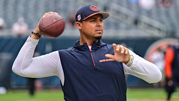 Aug 17, 2024; Chicago, Illinois, USA; Chicago Bears general manager Ryan Poles plays catch on the sideline before the game against the Cincinnati Bengals at Soldier Field. Mandatory Credit: Daniel Bartel-Imagn Images