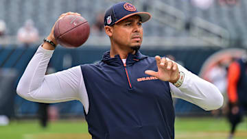 Chicago Bears general manager Ryan Poles plays catch on the sideline before the game against the Cincinnati Bengals at Soldier Field.