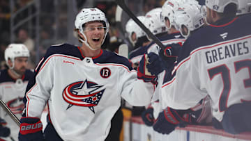 Mar 21, 2025; Pittsburgh, Pennsylvania, USA;  Columbus Blue Jackets center Kent Johnson (91) celebrates with the  Blue Jackets bench after scoring a goal against the Pittsburgh Penguins during the third period at PPG Paints Arena. Mandatory Credit: Charles LeClaire-Imagn Images