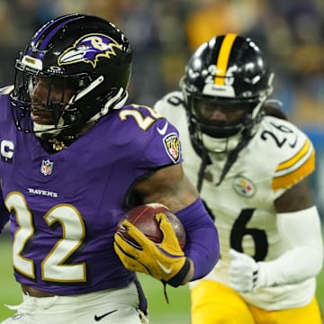 Jan 11, 2025; Baltimore, Maryland, USA; Baltimore Ravens running back Derrick Henry (22) runs against the Pittsburgh Steelers in the first quarter in an AFC wild card game at M&T Bank Stadium. Mandatory Credit: Mitch Stringer-Imagn Images